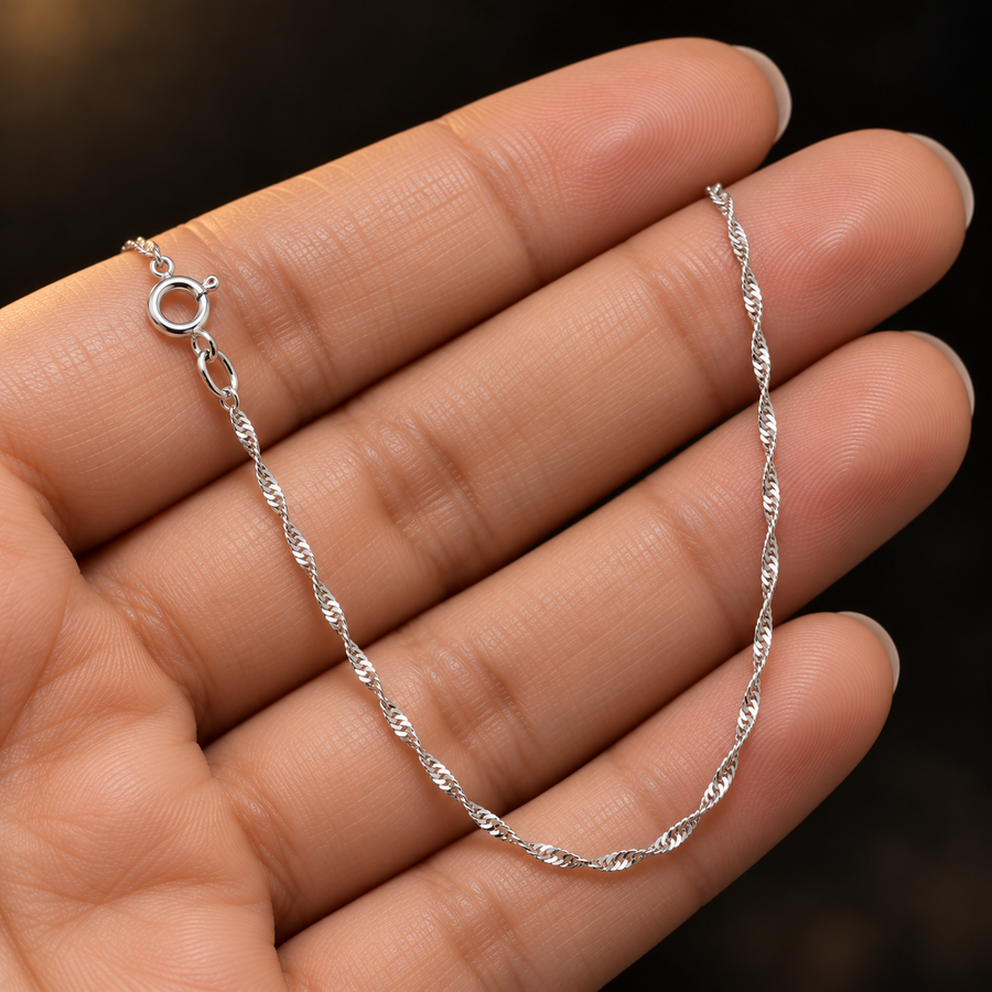 1.4mm Rhodium-Plated Sterling Silver Singapore Chain held in hand