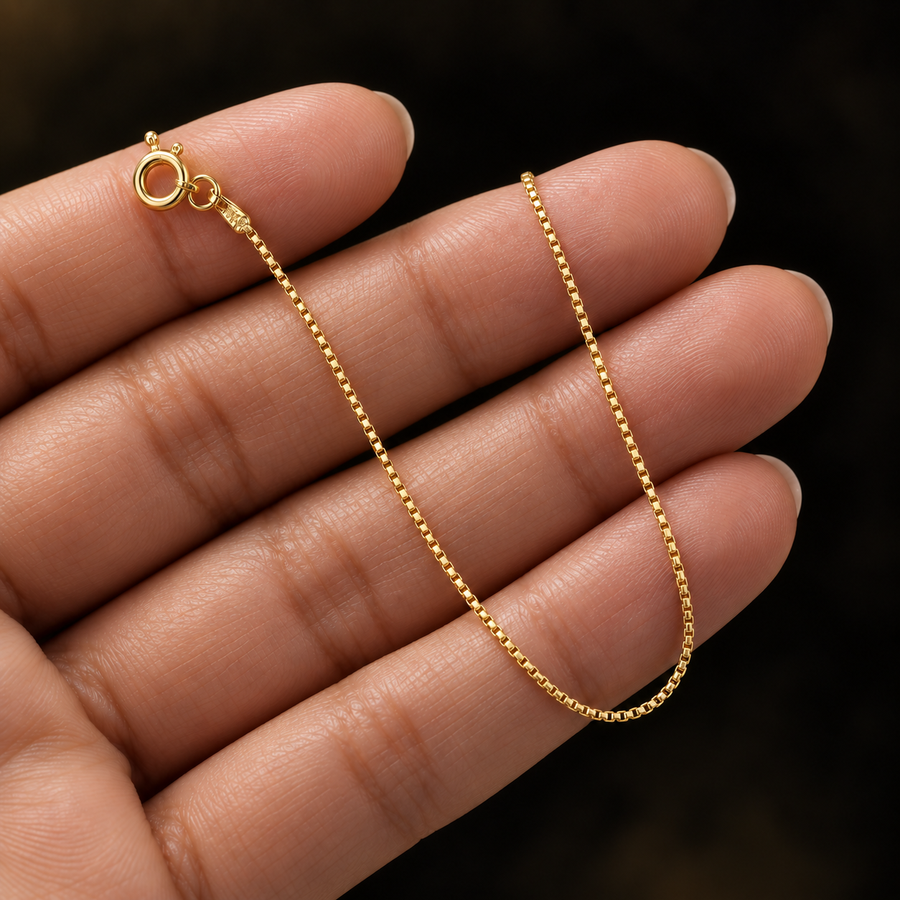 0.8mm Gold-Plated Sterling Silver Box Chain held in hand