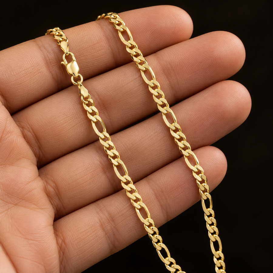 2.7mm Gold-Plated Sterling Silver Figaro Chain held in hand