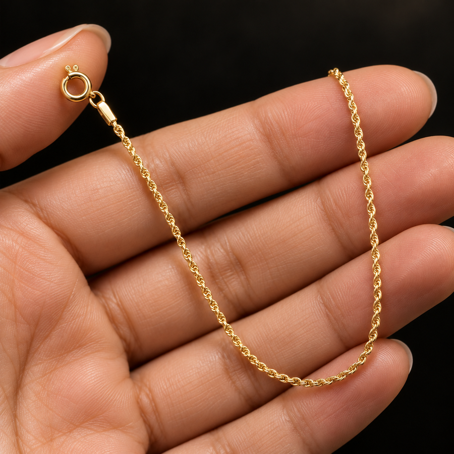 1.5mm Gold-Plated Sterling Silver Rope Chain held in hand